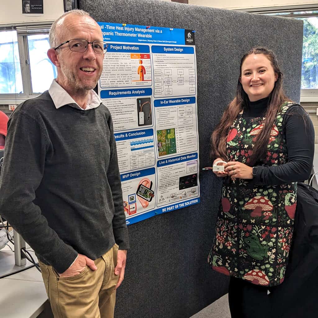 Simon Bull and Mikyla Peters in front of Mikyla's project poster